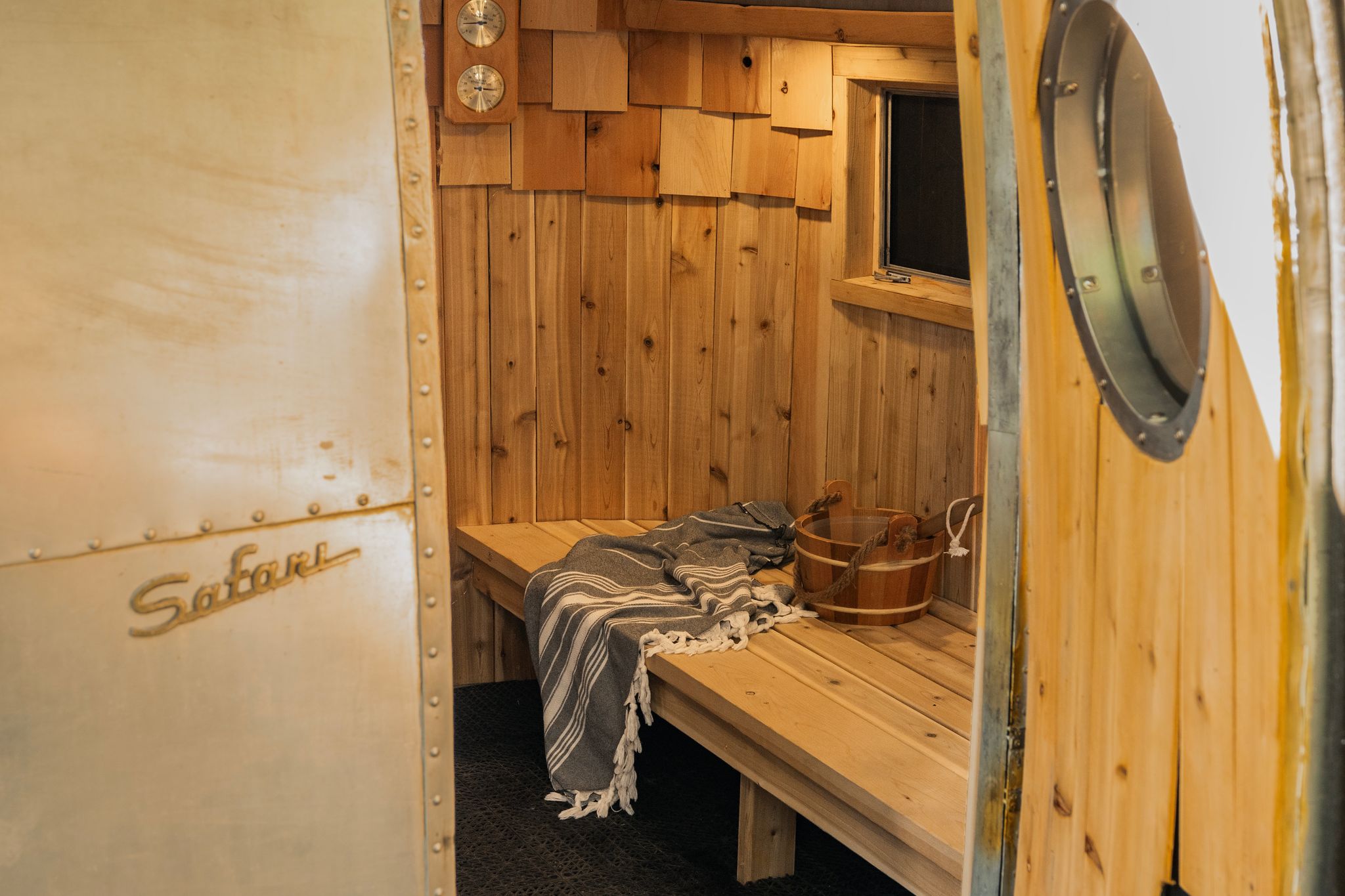 View through the vintage Airstream Safari door into the cedar sauna