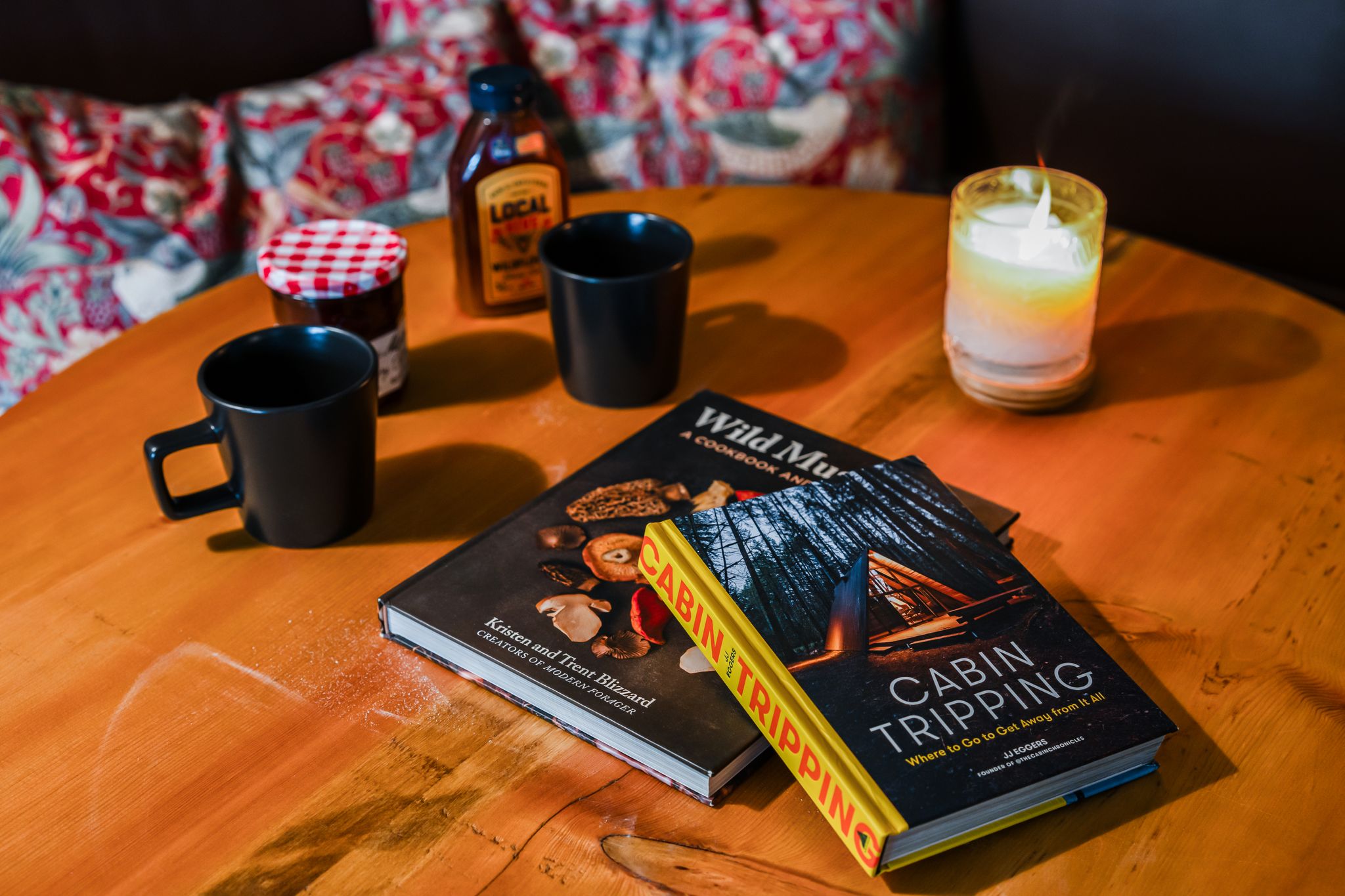 Curated cabin books and coffee on the table
