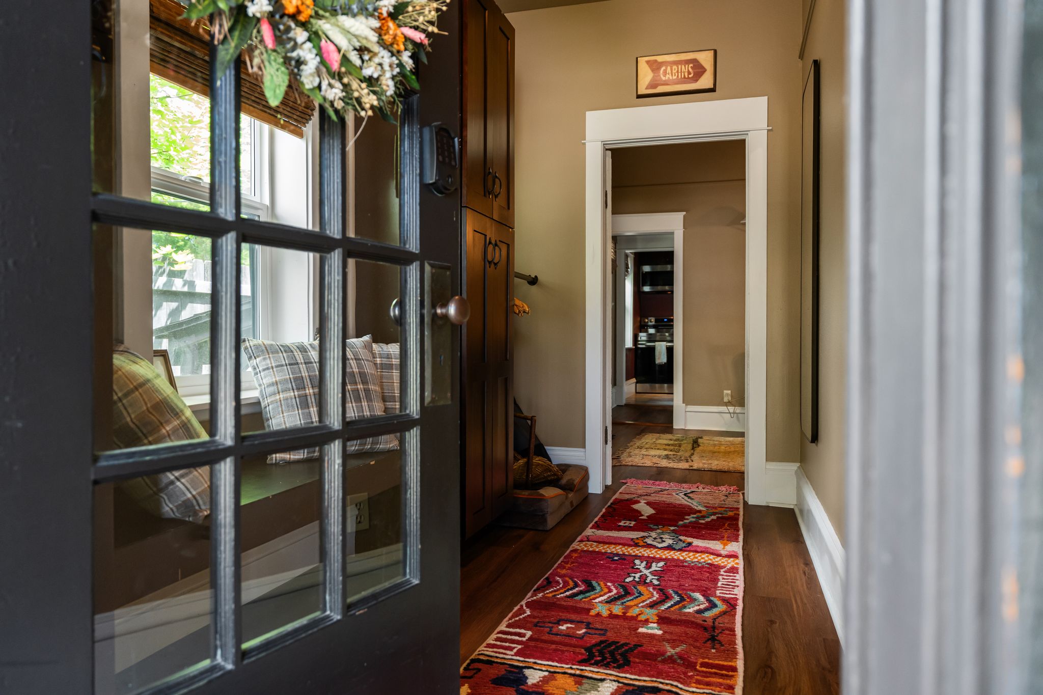 Welcoming entryway with vintage rug and cabin decor