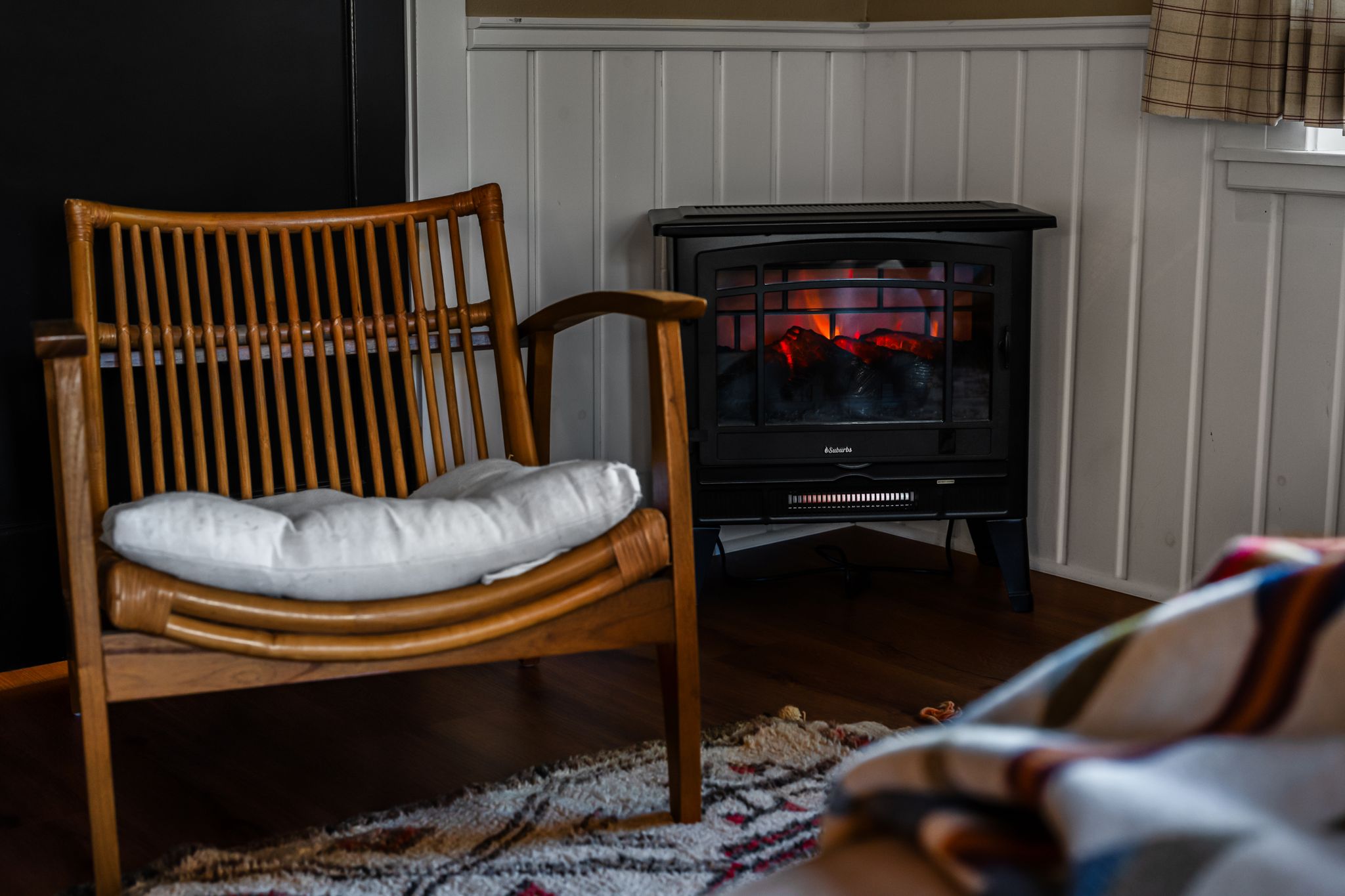 Cozy fireplace with mid-century lounge chair