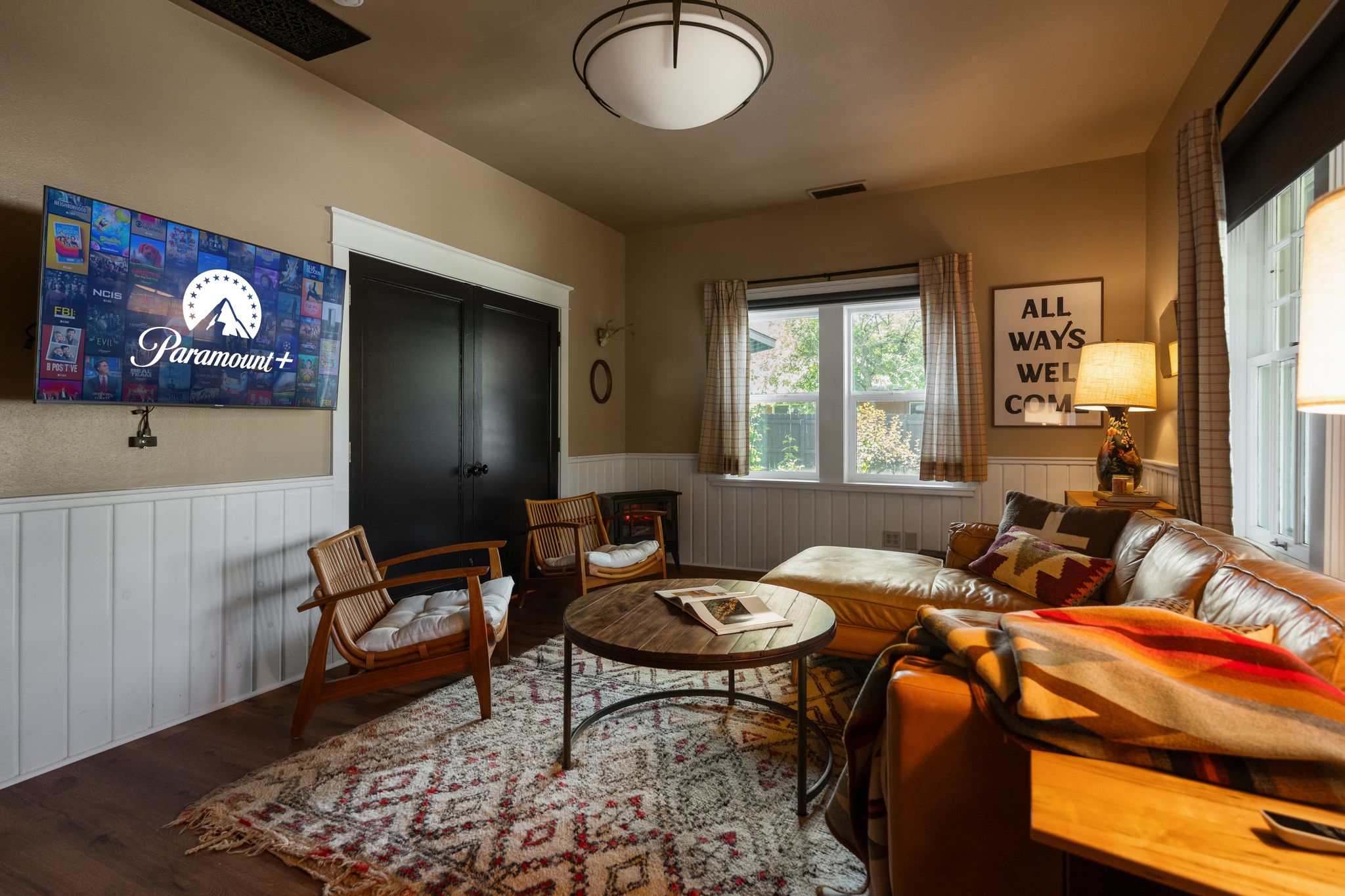 Spacious living room with smart TV and lounge seating